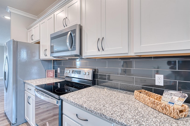 19138 Braeburn Dr, Evansville, IN 47725 - kitchen featuring backsplash, crown molding, light stone countertops, white cabinets, and stainless steel appliances