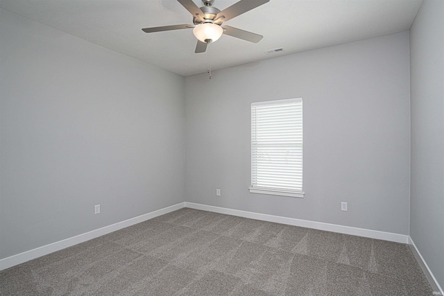 19138 Braeburn Dr, Evansville, IN 47725 - spare room featuring dark colored carpet, visible vents, baseboards, and a ceiling fan