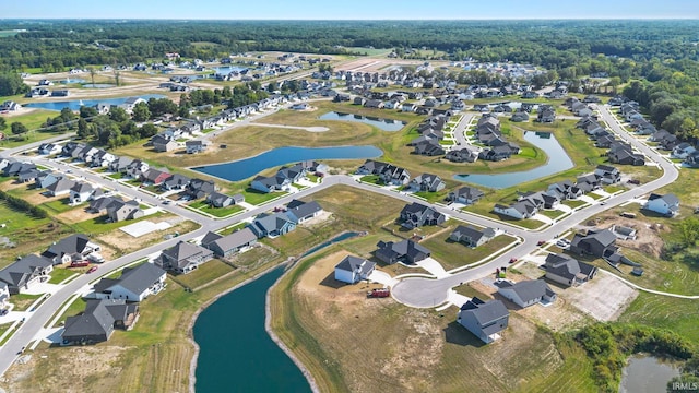 birds eye view of property featuring a residential view and a water view