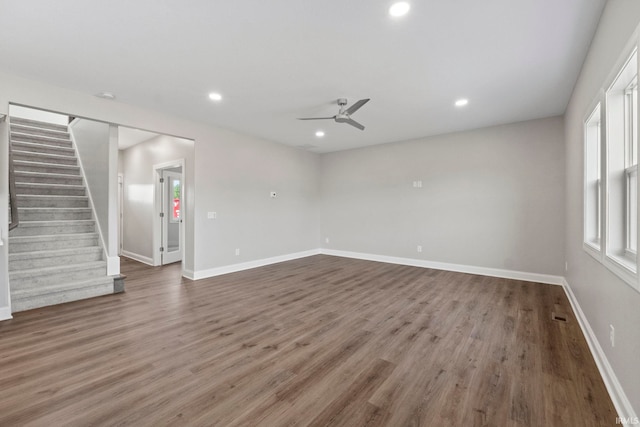 unfurnished living room with stairway, recessed lighting, wood finished floors, and ceiling fan