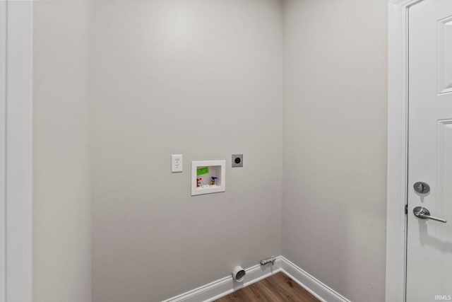 clothes washing area with dark wood finished floors, baseboards, hookup for an electric dryer, hookup for a washing machine, and laundry area