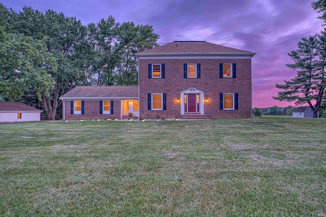 9700 Big Cynthiana Rd, Evansville, IN 47720 - colonial home featuring a lawn and brick siding