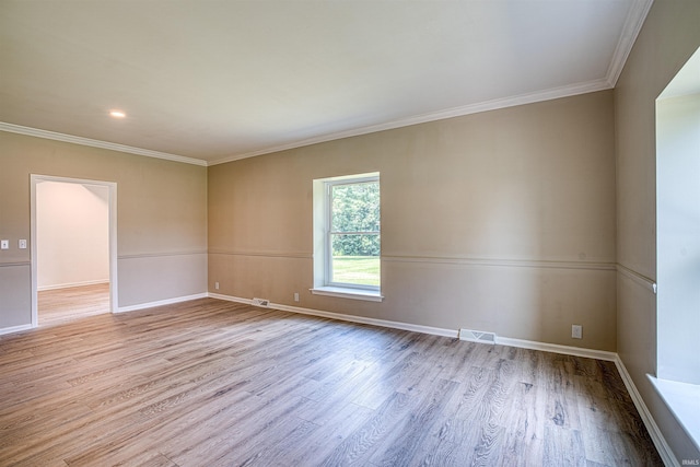 9700 Big Cynthiana Rd, Evansville, IN 47720 - spare room featuring baseboards, wood finished floors, visible vents, and ornamental molding