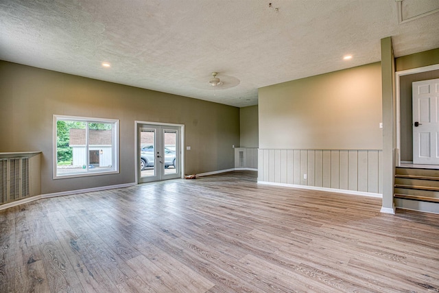 9700 Big Cynthiana Rd, Evansville, IN 47720 - empty room featuring french doors, a textured ceiling, and wood finished floors