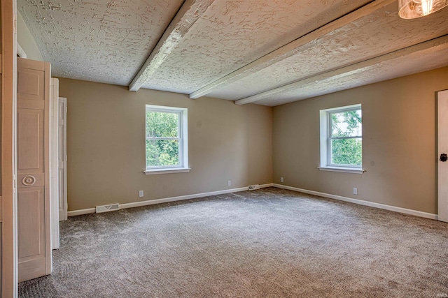 9700 Big Cynthiana Rd, Evansville, IN 47720 - unfurnished room with beamed ceiling, visible vents, carpet flooring, and baseboards
