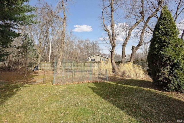 view of yard with a garden and fence