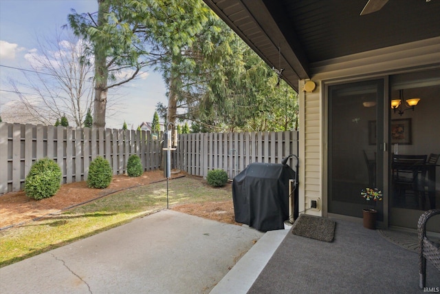 view of patio / terrace featuring area for grilling and fence