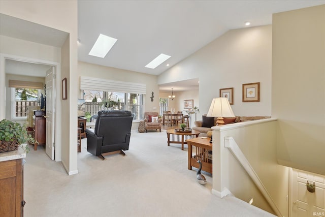 living room with recessed lighting, high vaulted ceiling, light colored carpet, and a skylight