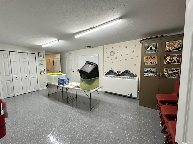 316 N Main St, Churubusco, IN 46723 - rec room featuring speckled floor and a textured ceiling