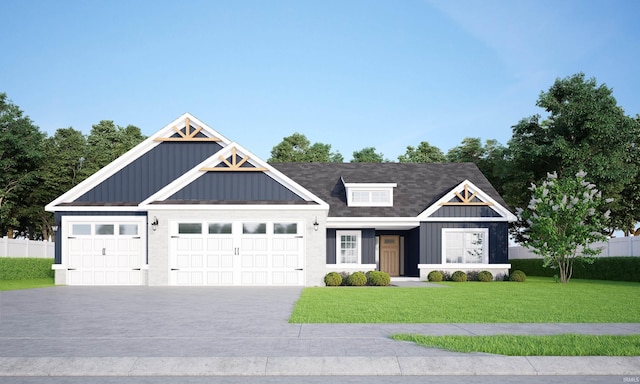 372 Carlton Dr, West Lafayette, IN 47906 - view of front facade with board and batten siding, an attached garage, a front yard, and driveway
