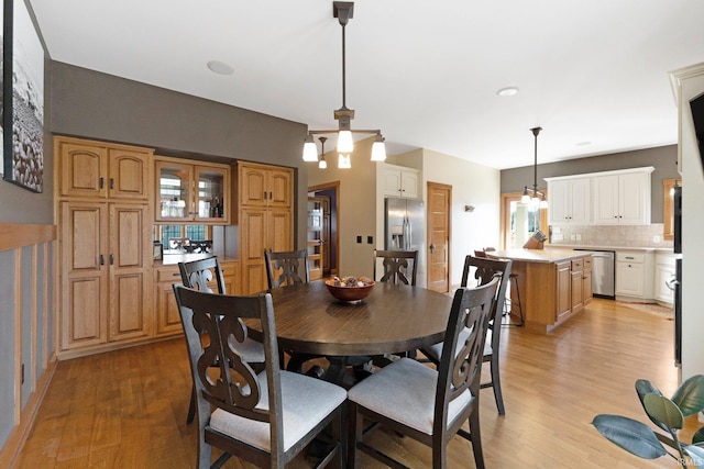 dining room featuring light wood finished floors