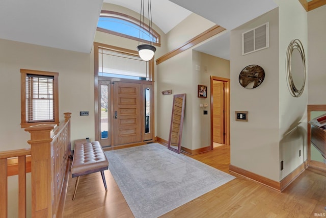 entryway featuring light wood-style floors, visible vents, and baseboards