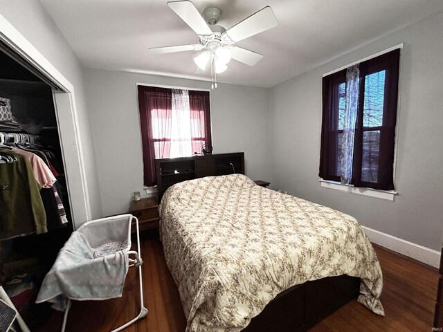 1428 11th St, Tell City, IN 47586 - bedroom featuring a closet, ceiling fan, dark wood-type flooring, and baseboards