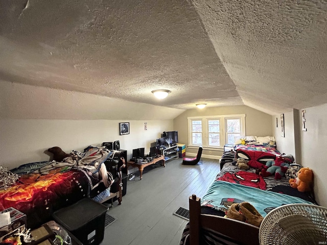 1428 11th St, Tell City, IN 47586 - bedroom featuring wood-type flooring, a textured ceiling, and vaulted ceiling