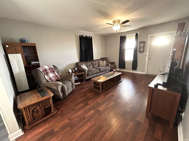 1428 11th St, Tell City, IN 47586 - living area with dark wood-style floors, baseboards, and a ceiling fan