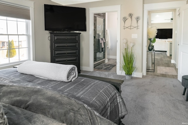 carpeted bedroom with baseboards