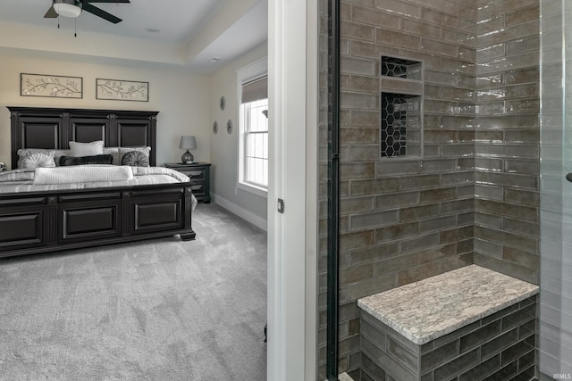 bedroom featuring baseboards and light carpet