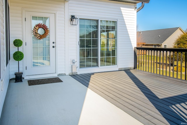 property entrance featuring a wooden deck