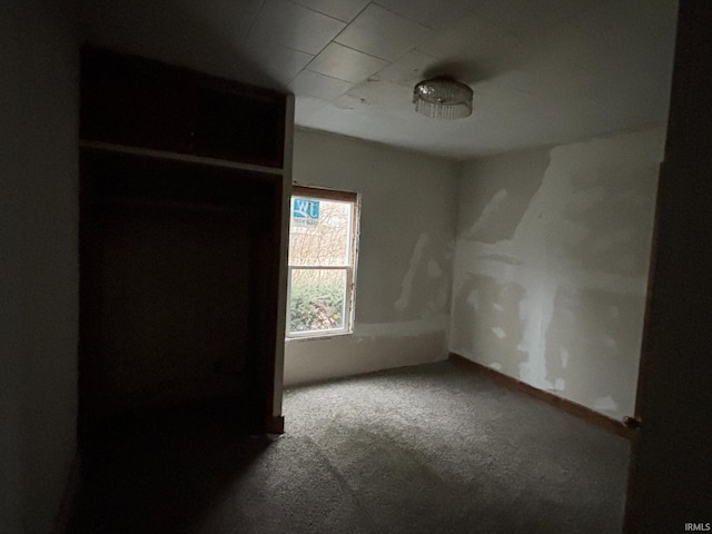 unfurnished bedroom with baseboards and carpet floors