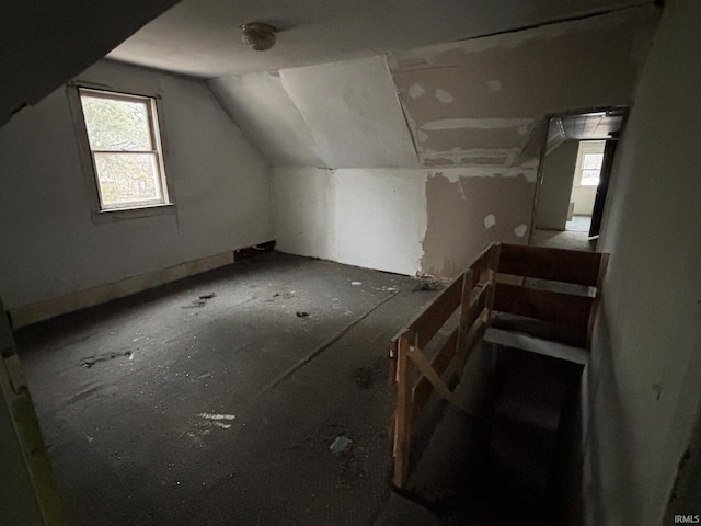 additional living space with vaulted ceiling