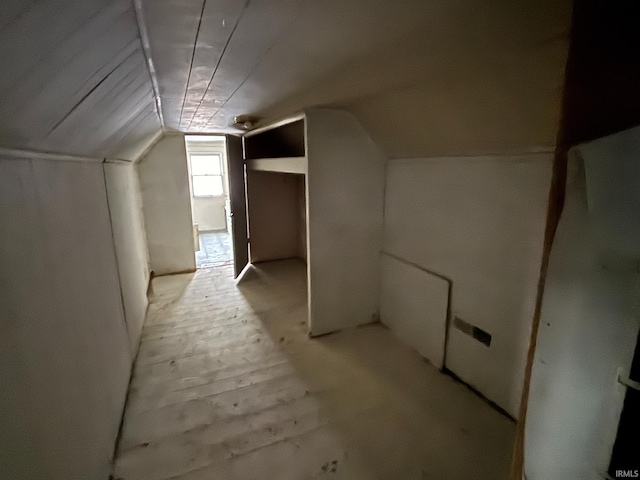 additional living space with vaulted ceiling