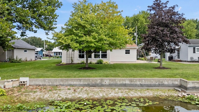 760 Ln 136 Turkey Lk, Hudson, IN 46747 - back of property featuring a patio area and a lawn