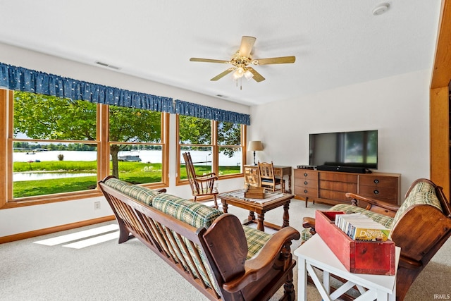 760 Ln 136 Turkey Lk, Hudson, IN 46747 - living room with visible vents, baseboards, a water view, carpet flooring, and a ceiling fan
