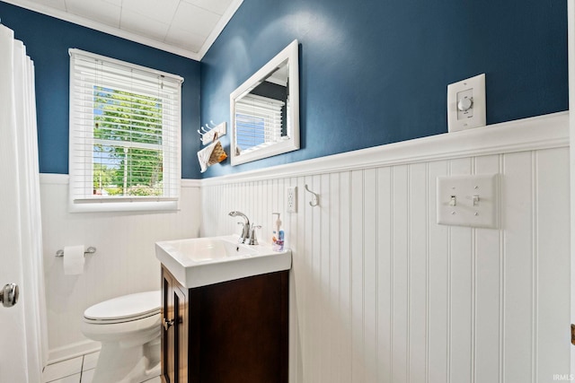 760 Ln 136 Turkey Lk, Hudson, IN 46747 - bathroom featuring a wainscoted wall, toilet, ornamental molding, tile patterned floors, and vanity