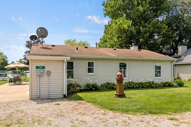 760 Ln 136 Turkey Lk, Hudson, IN 46747 - back of house with a patio area and a lawn