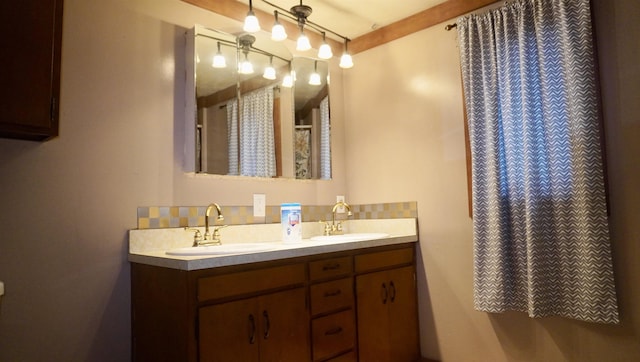 bathroom with double vanity and a sink