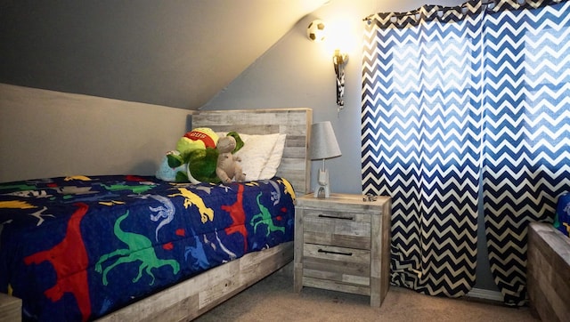 carpeted bedroom with vaulted ceiling