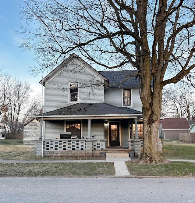 view of front of house featuring a porch and a shingled roof