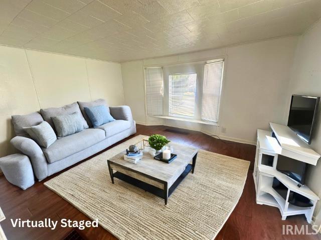 1130 N Lindsay St, Kokomo, IN 46902 - living area with wood finished floors and baseboards