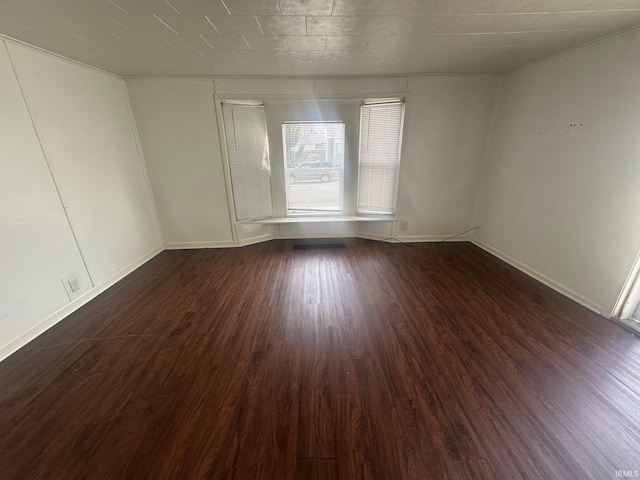 1130 N Lindsay St, Kokomo, IN 46902 - empty room with dark wood finished floors and baseboards