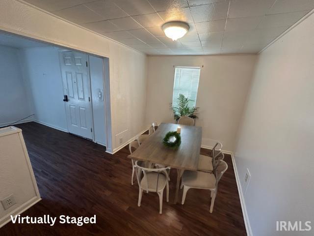 1130 N Lindsay St, Kokomo, IN 46902 - unfurnished dining area featuring wood finished floors and baseboards