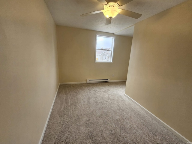 carpeted empty room featuring a baseboard heating unit, baseboards, and ceiling fan