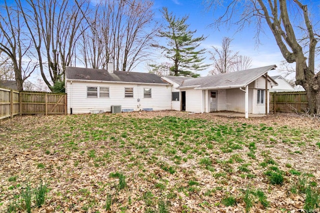 5018 Graham Ave, Evansville, IN 47715 - back of house featuring a chimney, central air condition unit, and a fenced backyard