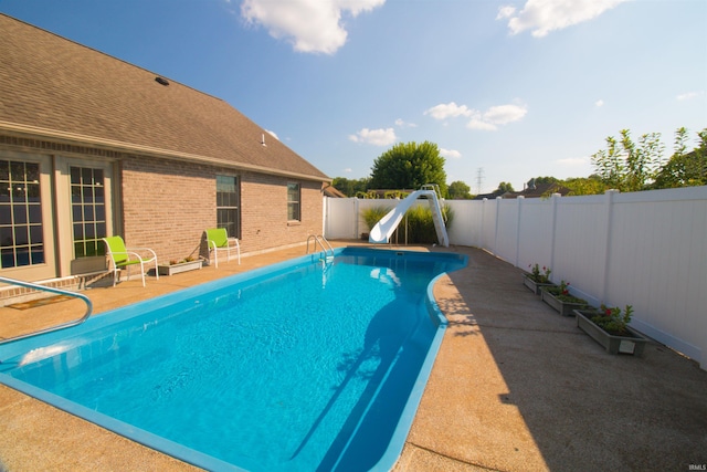 742 Trillium Way, Evansville, IN 47712 - view of swimming pool with a fenced in pool, a fenced backyard, a patio area, and a water slide