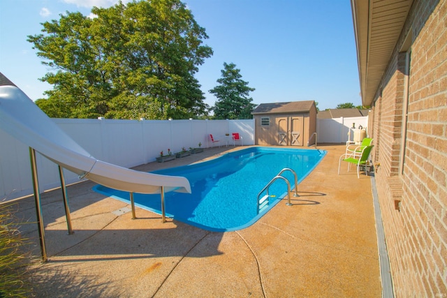 742 Trillium Way, Evansville, IN 47712 - view of pool with a storage unit, a water slide, a fenced backyard, an outbuilding, and a patio