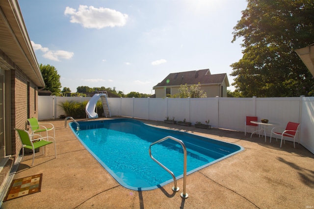 742 Trillium Way, Evansville, IN 47712 - view of swimming pool featuring a patio, a fenced backyard, a water slide, and a fenced in pool