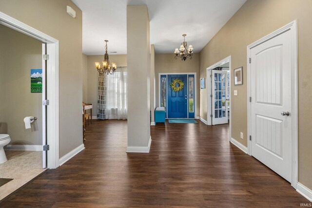 1814 Abbotsbury Way, Lafayette, IN 47909 - foyer featuring dark wood finished floors, a notable chandelier, and baseboards