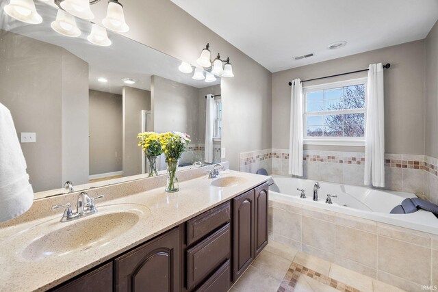 1814 Abbotsbury Way, Lafayette, IN 47909 - bathroom featuring a sink, visible vents, a garden tub, and a notable chandelier