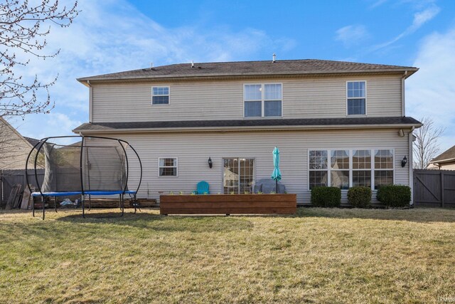 1814 Abbotsbury Way, Lafayette, IN 47909 - back of property with a trampoline, a lawn, and fence