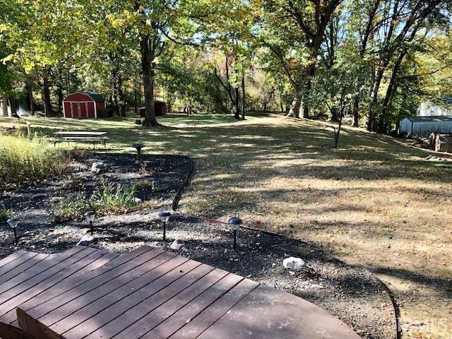 9420 Darmstadt Rd, Evansville, IN 47710 - view of yard with a storage shed and an outdoor structure