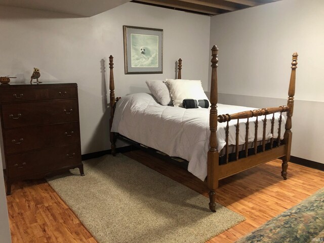 9420 Darmstadt Rd, Evansville, IN 47710 - bedroom featuring light wood-type flooring, baseboards, and vaulted ceiling