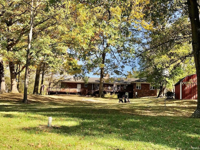 9420 Darmstadt Rd, Evansville, IN 47710 - view of yard featuring a deck and an outbuilding