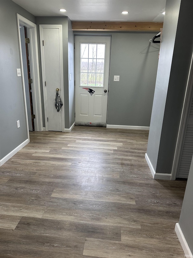 foyer with recessed lighting, wood finished floors, and baseboards
