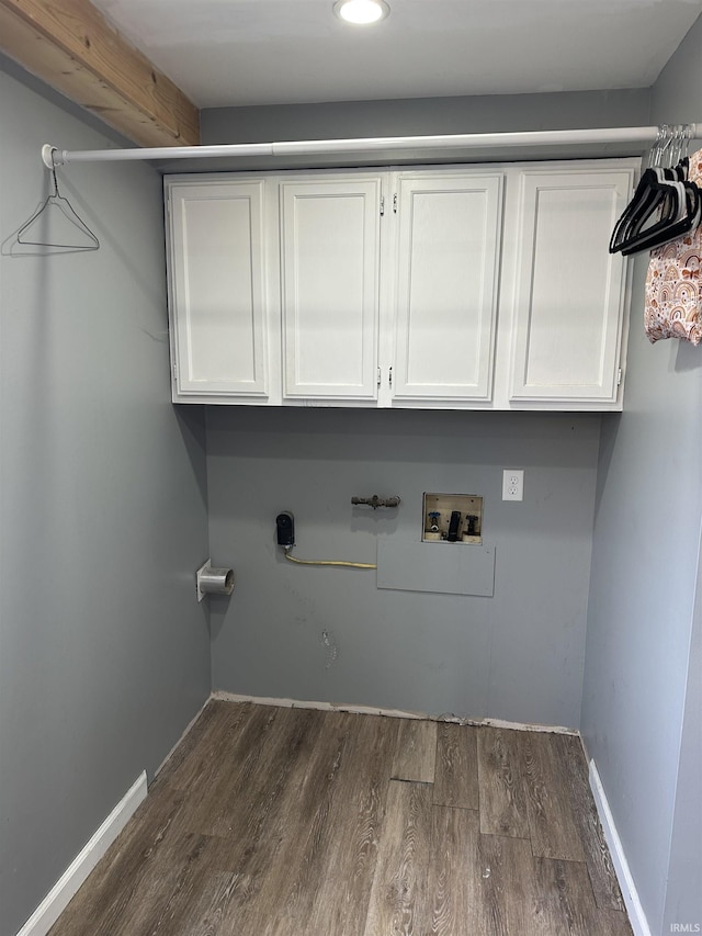 laundry room with recessed lighting, dark wood-type flooring, washer hookup, and cabinet space