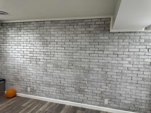room details with baseboards, wood finished floors, and visible vents