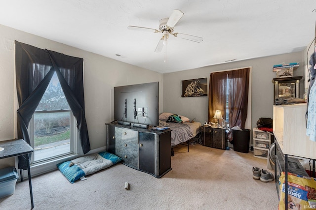 carpeted bedroom featuring a ceiling fan